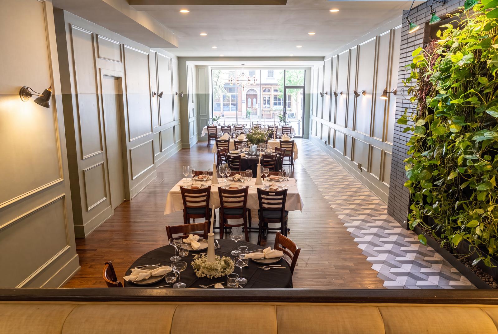 The length of the room, from the living wall to the front windows